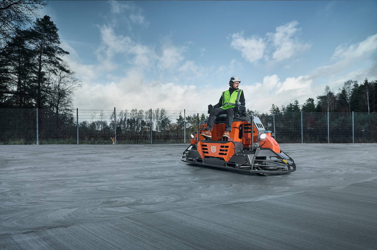 Husqvarna CRT 48 PS Ride-On Trowel in Action on Concrete Job Site